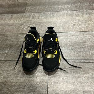 black and yellow jordan 4 (Thunder 4s)